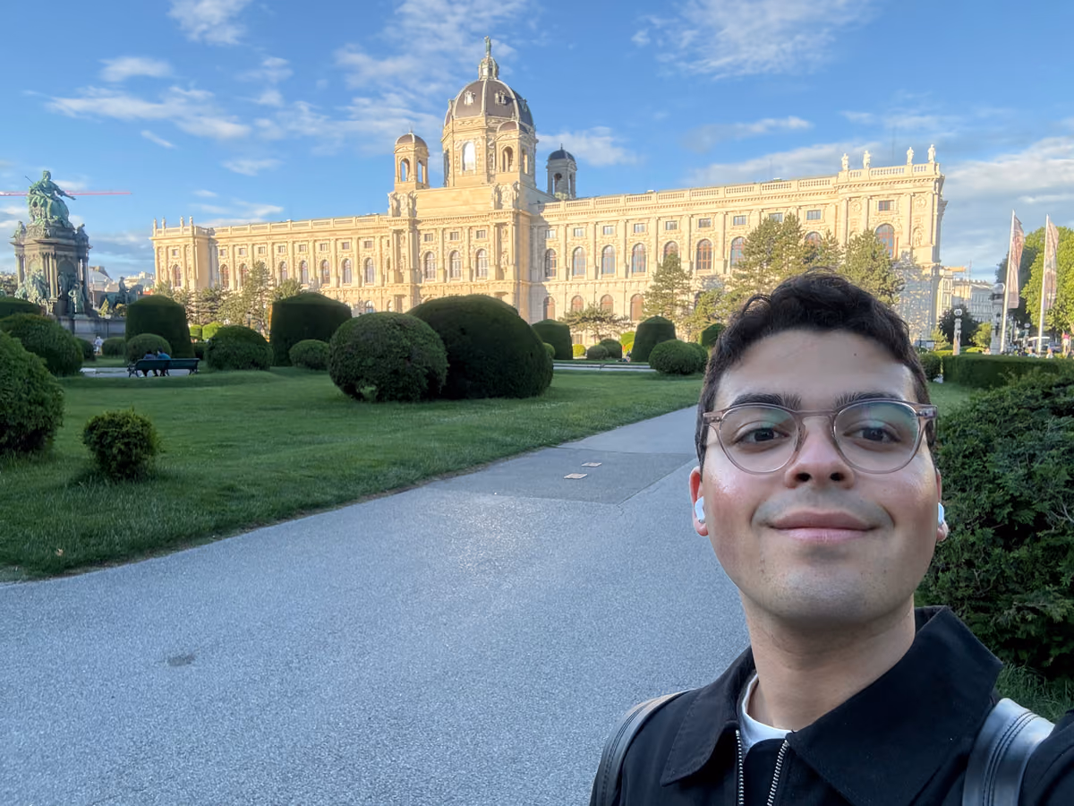 Selfie outside a grand domed museum in Vienna on a sunny day